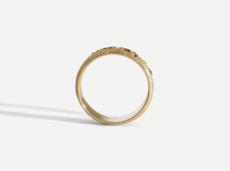 Silhouette view of the ring to show the raised gold bumps