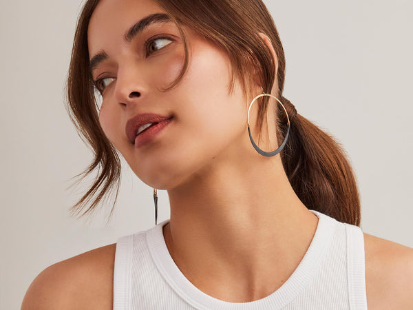 model wearing large isla wish hoop