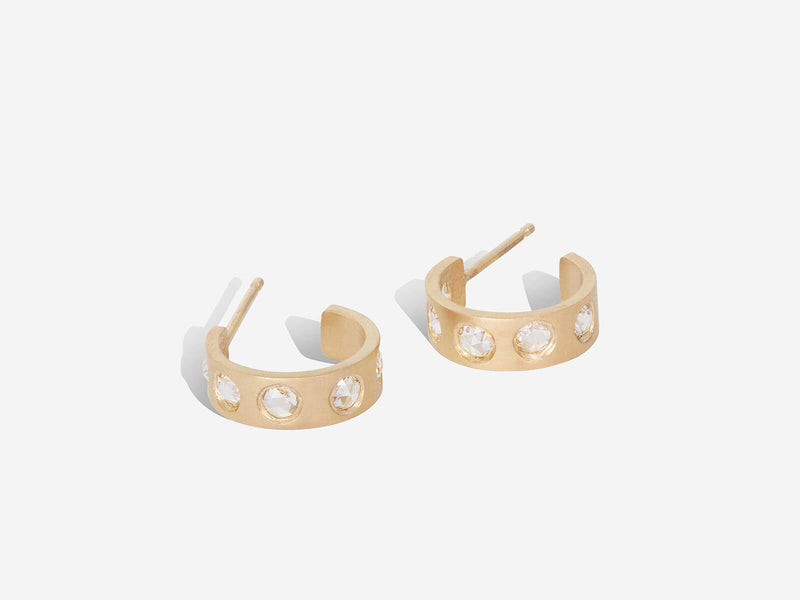 rose-cut diamond hoops laying flat on their sides