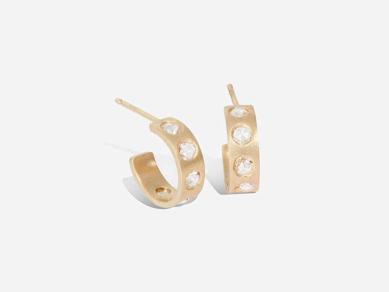 Front view of huggie hoops. The left earring is turned at an angle