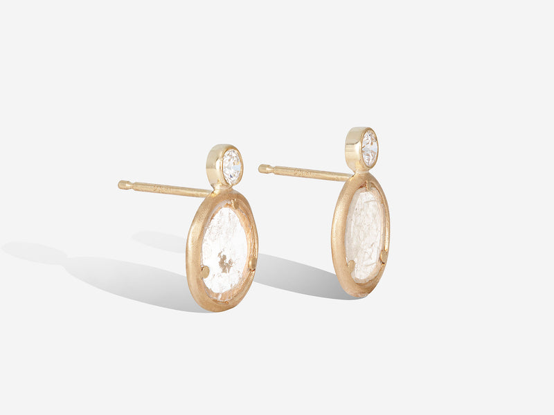 Three quarters view of standing diamond slice bling studs