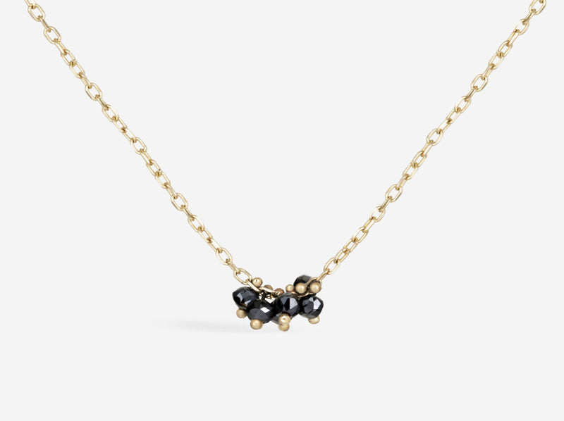 Details of center cluster to show beads secured to chain with gold pin and balls.