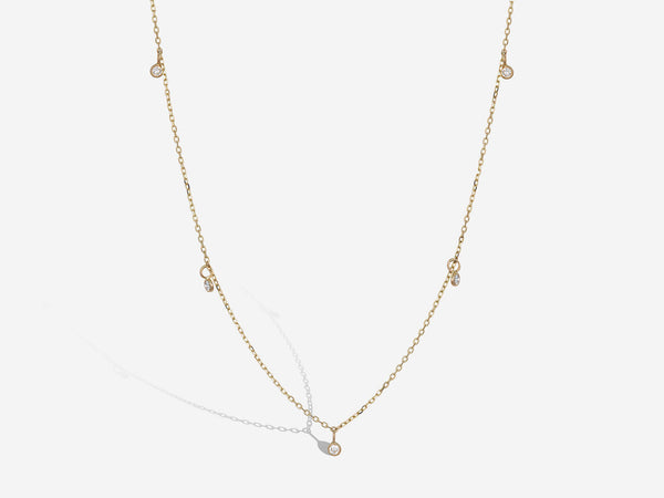 Front hanging view of diamond drop floater necklace
