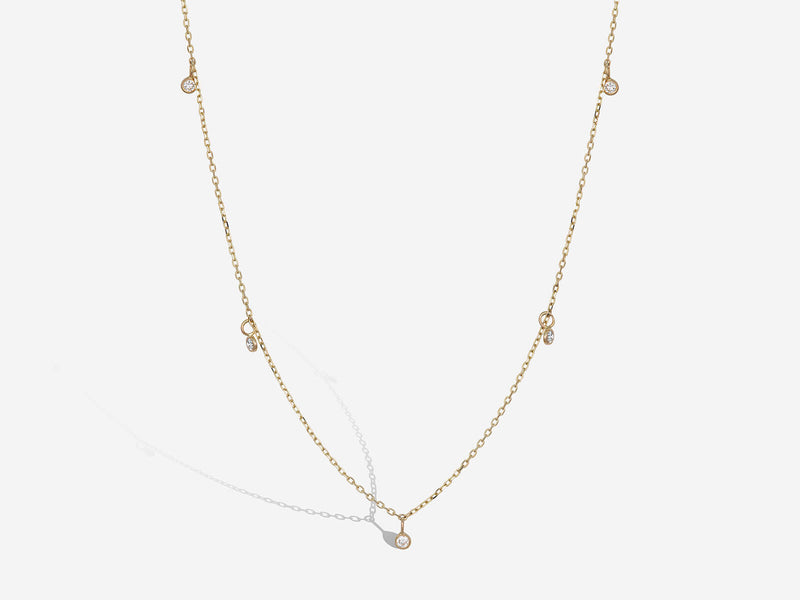 Front hanging view of diamond drop floater necklace