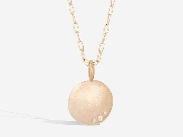 front view of pendant in 14k gold with white diamonds and wide oval chain