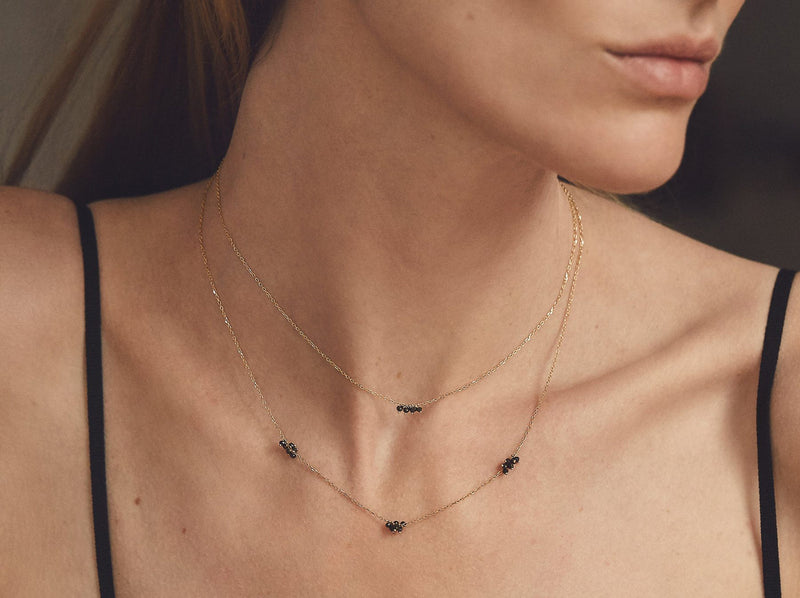 Model wears the necklace underneath a 16 inch necklace to show layering compatibility