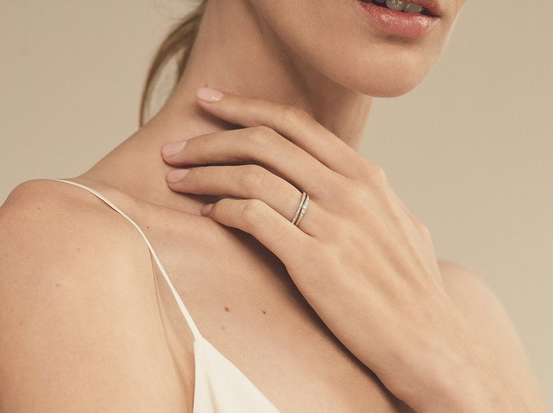Model wearing Large Flamenco Ring as part of bridal set with 1 mm eternity band
