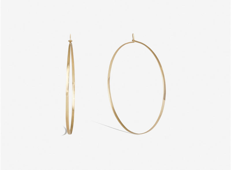 Medium hoopla in 14k yellow gold. 14k yellow gold wire is forged flat for strength and shape.