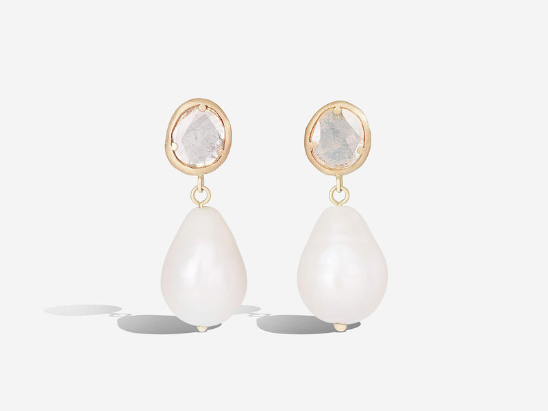 Front hanging view of diamond slice pearl drop earrings