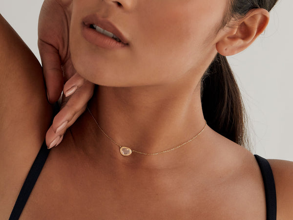 Close up of model wearing necklace